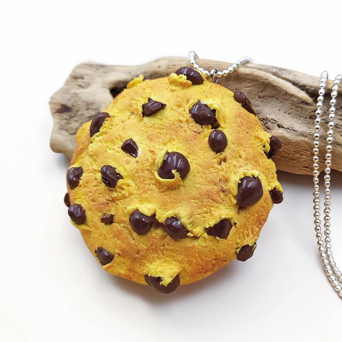 Chocolate chip cookie jewelry with durable stainless steel ball chain.