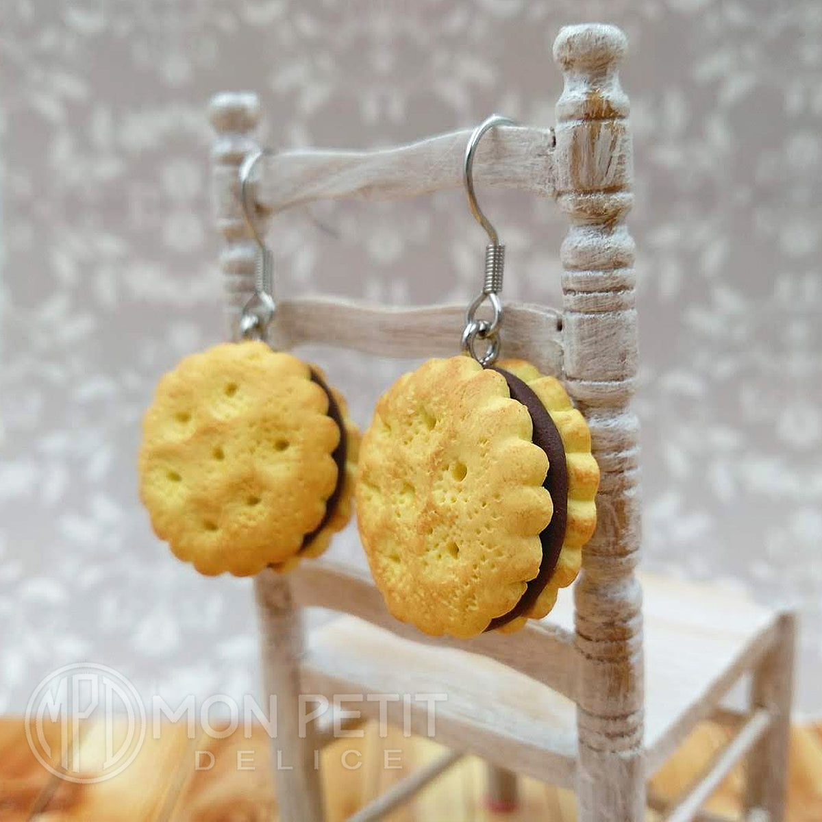 Kawaii chocolate sandwich cookie earrings handmade miniature food on white chair.