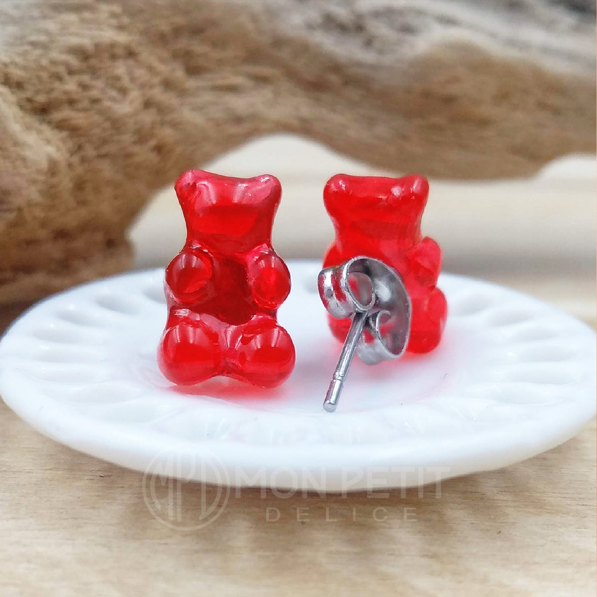 Back view of red resin gummy bear earring showing hypoallergenic stainless steel post for sensitive ears.