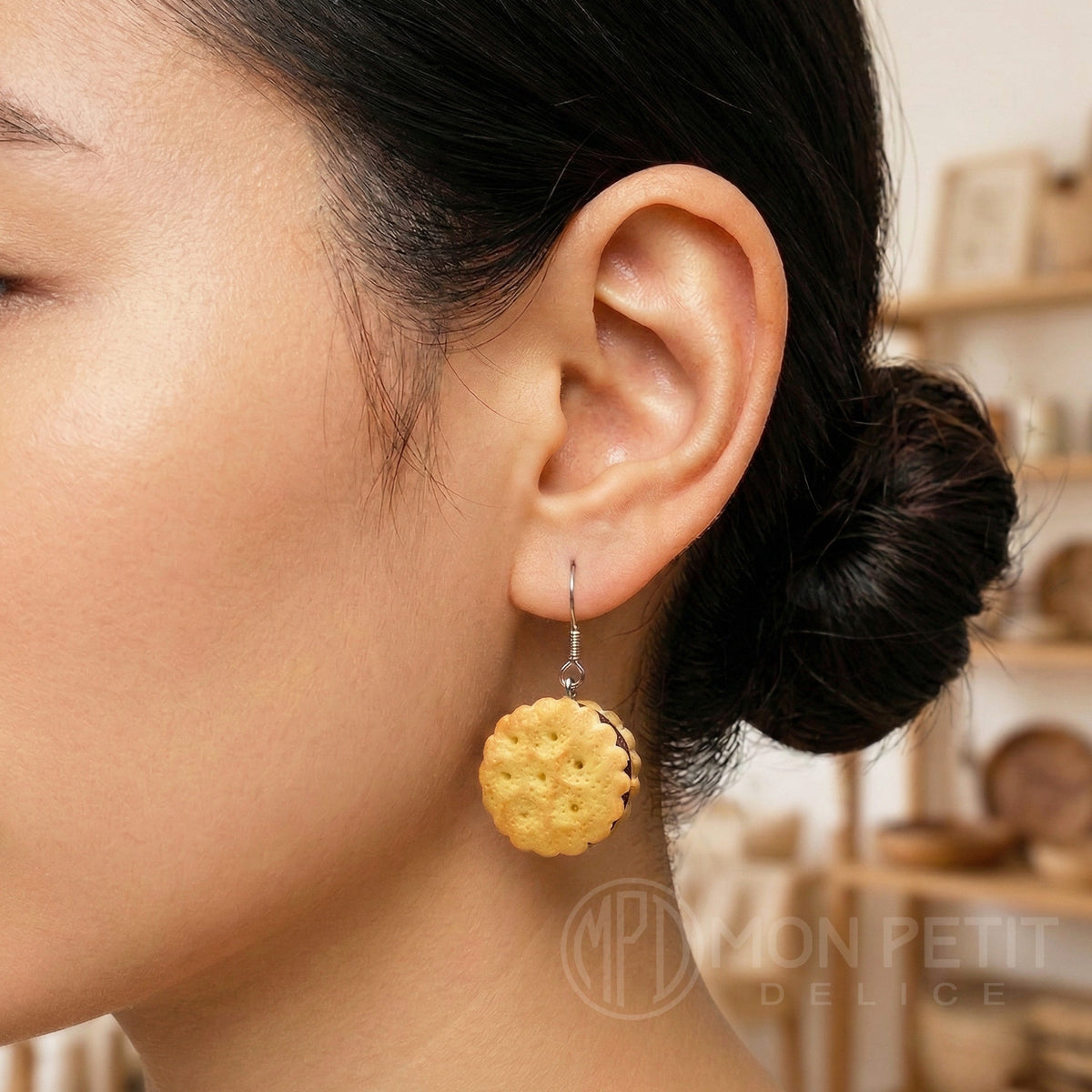 Model wearing chocolate cookie dangle earring kawaii aesthetic jewelry.