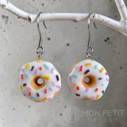 White sprinkle donut dangle earrings in polymer clay and surgical stainless steel.