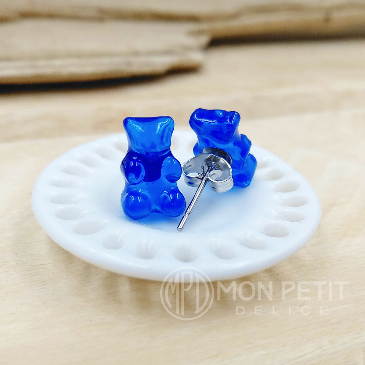 Back view of blue gummy bear stud earrings with hypoallergenic stainless steel posts