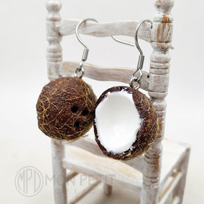 Side view of handmade coconut dangle earrings with stainless steel hooks