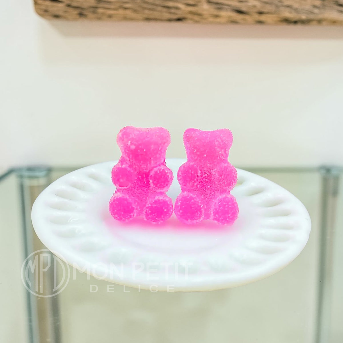 Pink sugar gummy bear stud earrings handmade in resin, close-up view