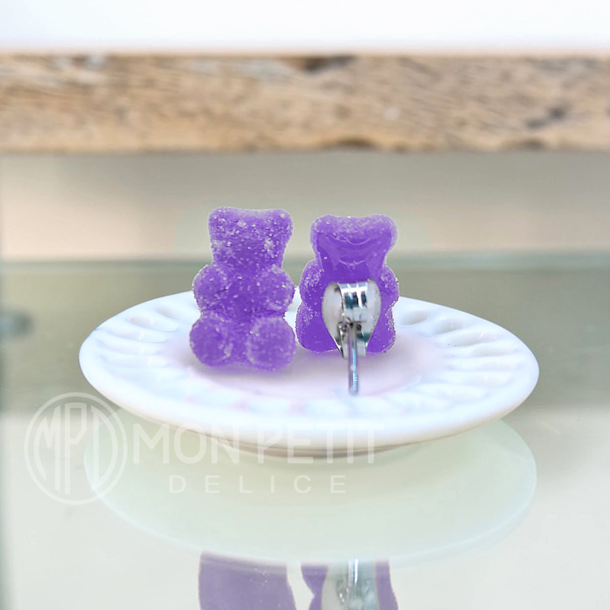 Back view of handmade purple sugar gummy bears stud earrings with stainless steel